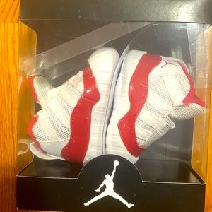 White and red Jordan 11 booties